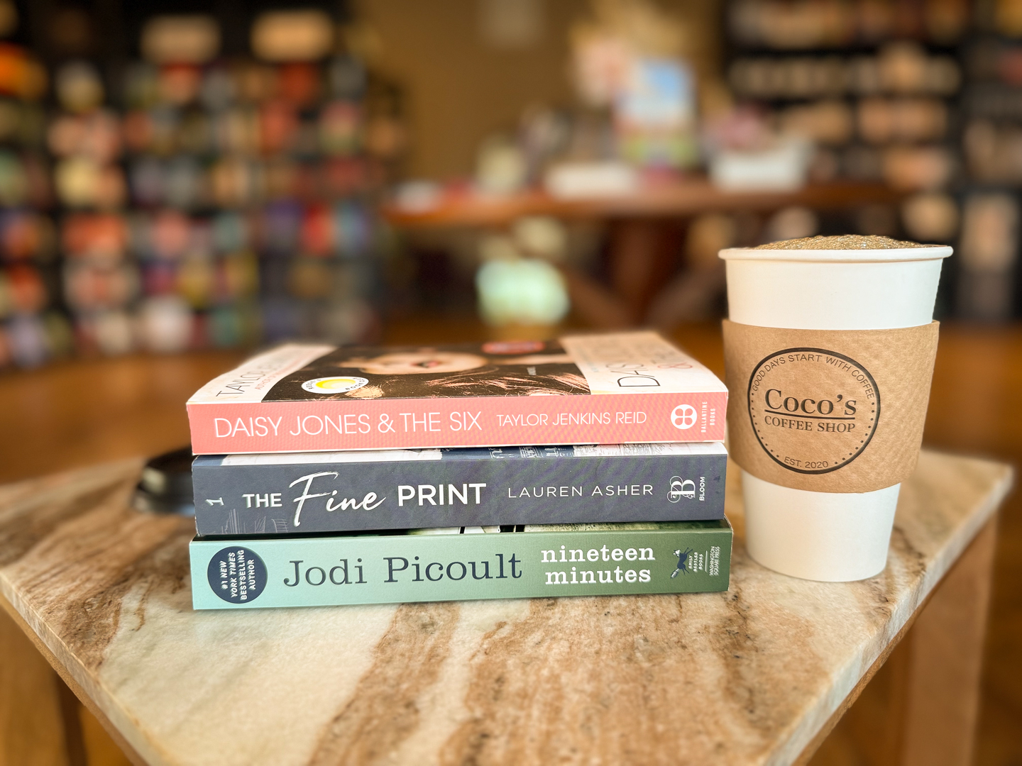 Latte beside an open book